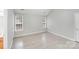 Spacious bedroom showcasing modern flooring, and multiple windows offering ample natural light at 6216 Bandy Dr, Charlotte, NC 28227