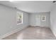 Spacious living room with neutral paint, new floors, and natural light at 6216 Bandy Dr, Charlotte, NC 28227