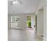 Open living area with new flooring, a large window, and a view of the front yard at 6216 Bandy Dr, Charlotte, NC 28227