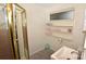 Practical bathroom including stand up shower, floating shelves and ample lighting at 709 Sunset Dr, Salisbury, NC 28147