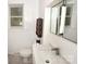 Modern bathroom with a large mirror, updated sink, and a window for natural light at 709 Sunset Dr, Salisbury, NC 28147