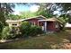 Well-maintained brick home with lush greenery and a cozy entrance showcasing a serene setting at 709 Sunset Dr, Salisbury, NC 28147