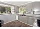 Kitchen featuring neutral-colored cabinets, white appliances and countertop space at 709 Sunset Dr, Salisbury, NC 28147