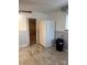 Bright kitchen featuring a large refrigerator and modern flooring at 709 Sunset Dr, Salisbury, NC 28147