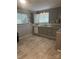 Kitchen boasting gray cabinets, a stylish sink, and a bright window at 709 Sunset Dr, Salisbury, NC 28147