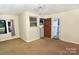 Inviting living area features neutral tones, a window with natural light and an open doorway at 709 Sunset Dr, Salisbury, NC 28147