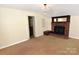 Large living room features a fireplace and neutral decor offers a versatile living space at 709 Sunset Dr, Salisbury, NC 28147