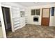 Living room area featuring built-in shelving and a door to the outside at 709 Sunset Dr, Salisbury, NC 28147