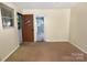 Bright and airy room with neutral decor, plenty of natural light, and open access to other rooms at 709 Sunset Dr, Salisbury, NC 28147