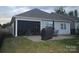 The house has an outdoor living space with a paved patio, an outdoor dining set and a covered screened-in porch at 813 Latrobe Dr # 365, Iron Station, NC 28080