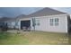 The house has an outdoor living space with a paved patio, an outdoor dining set and a covered screened-in porch at 813 Latrobe Dr # 365, Iron Station, NC 28080