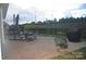 The house has an outdoor living space with a paved patio and an outdoor dining set overlooking a grassy backyard at 813 Latrobe Dr # 365, Iron Station, NC 28080