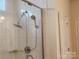 Bathroom featuring a tile shower and chrome shower head at 813 Latrobe Dr # 365, Iron Station, NC 28080