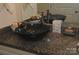 Close up of granite countertop and vessel sink with decorative accents at 813 Latrobe Dr # 365, Iron Station, NC 28080