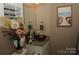 Bathroom with a vessel sink, granite countertop, and a decorative painting on the wall at 813 Latrobe Dr # 365, Iron Station, NC 28080