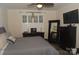 Comfortable bedroom with a ceiling fan, dresser, mirror, and TV on the wall at 813 Latrobe Dr # 365, Iron Station, NC 28080