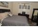 Comfortable bedroom featuring a large bed, dresser, and ample natural light at 813 Latrobe Dr # 365, Iron Station, NC 28080