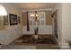 Formal dining room showcasing elegant wainscoting, a modern chandelier, and neutral tones at 813 Latrobe Dr # 365, Iron Station, NC 28080