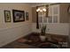 Lovely dining room with decorative wainscoting, a modern chandelier, and picture frame art at 813 Latrobe Dr # 365, Iron Station, NC 28080