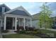Attractive single-Gathering home with a manicured lawn, covered front porch, and a two-car attached garage at 813 Latrobe Dr # 365, Iron Station, NC 28080