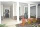 Inviting covered front porch with rocking chairs and decorative plants, a cozy spot to relax outdoors at 813 Latrobe Dr # 365, Iron Station, NC 28080