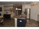 Kitchen featuring an island with granite countertops and stainless steel appliances at 813 Latrobe Dr # 365, Iron Station, NC 28080
