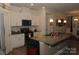 Kitchen featuring an island with granite countertops and stainless steel appliances at 813 Latrobe Dr # 365, Iron Station, NC 28080