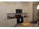 Kitchen featuring white cabinets and stainless steel appliances at 813 Latrobe Dr # 365, Iron Station, NC 28080