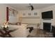 Comfortable living room boasts stylish decor, a fireplace, and lots of natural light from the windows at 813 Latrobe Dr # 365, Iron Station, NC 28080