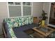 Relaxing screened-in porch with comfortable seating, perfect for enjoying the outdoors in comfort and style at 813 Latrobe Dr # 365, Iron Station, NC 28080