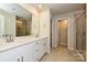 Bathroom with double sinks, quartz countertops, and a tiled shower at 815 Blue Canyon Dr, York, SC 29745