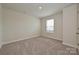 Cozy bedroom with carpet, natural light, and neutral walls creating a calming atmosphere at 815 Blue Canyon Dr, York, SC 29745