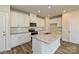 Modern kitchen featuring granite countertops, white cabinets, and stainless steel appliances at 815 Blue Canyon Dr, York, SC 29745