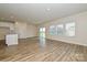Open-concept living area with a kitchen island, hardwood floors and plenty of natural light at 815 Blue Canyon Dr, York, SC 29745