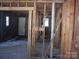 Interior view of a room with exposed wooden studs and some natural light coming through windows at 816 Parkwood Ave, Charlotte, NC 28205