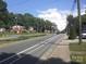 Street view featuring a road with surrounding buildings and foliage at 816 Parkwood Ave, Charlotte, NC 28205