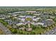 Aerial view of the commercial neighborhood with ample parking, sidewalks, greenery, and well-maintained buildings at 8410 Darcy Hopkins Dr, Charlotte, NC 28277