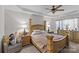 Inviting bedroom featuring a decorative ceiling, a large wood bed, and soft lighting for a relaxed atmosphere at 8410 Darcy Hopkins Dr, Charlotte, NC 28277
