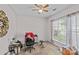 Simple bedroom with a ceiling fan and natural light streaming through a window at 8410 Darcy Hopkins Dr, Charlotte, NC 28277