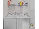 Laundry area with side by side, white washer and dryer at 8410 Darcy Hopkins Dr, Charlotte, NC 28277