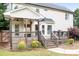 A wooden deck is attached to the house, with stairs leading down to the lawn at 9000 Petunia Ct, Gastonia, NC 28056