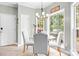 Sunny breakfast nook with glass table and bright windows, ideal for casual dining at 9000 Petunia Ct, Gastonia, NC 28056