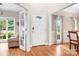 Bright entryway featuring hardwood floors, and views into the living spaces at 9000 Petunia Ct, Gastonia, NC 28056