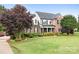 Beautiful brick two-story home with manicured lawn and lush landscaping at 9000 Petunia Ct, Gastonia, NC 28056