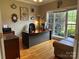 Inviting home office with hardwood floors, large window, and comfortable seating at 9000 Petunia Ct, Gastonia, NC 28056