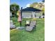 Backyard features lawn chairs, a grill, and an umbrella for outdoor enjoyment at 918 8Th St # 5, Lancaster, SC 29720