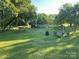 Large grassy backyard is fenced and features mature trees and outdoor seating at 918 8Th St # 5, Lancaster, SC 29720
