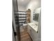 Bathroom features a modern vanity, wood-look flooring, and striped shower curtain at 918 8Th St # 5, Lancaster, SC 29720