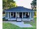 Charming single-story home features a cozy front porch and a well-manicured lawn with mature trees at 918 8Th St # 5, Lancaster, SC 29720