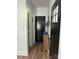 Inviting hallway featuring wood-look floors and modern black doors at 918 8Th St # 5, Lancaster, SC 29720